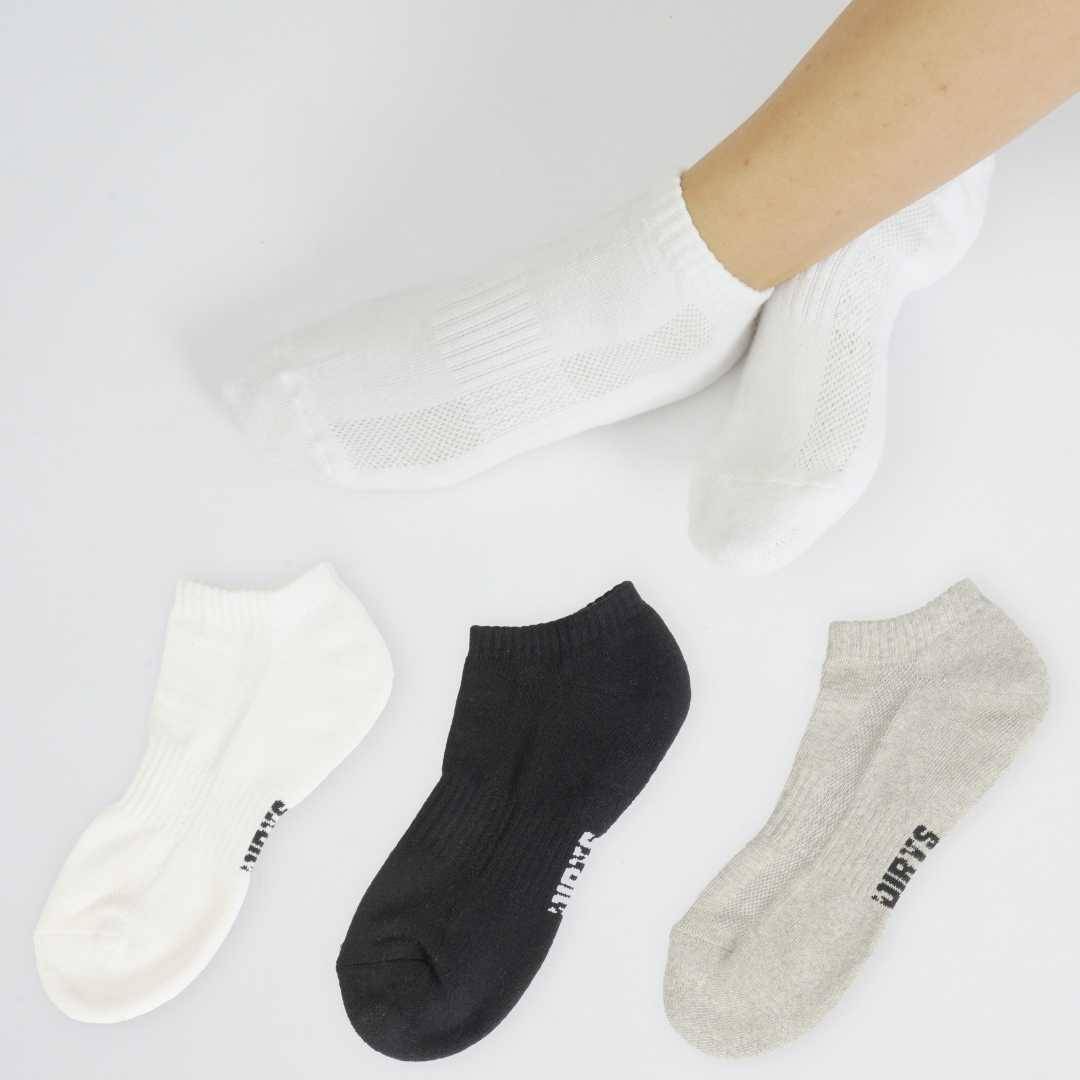Assorted sneaker socks in black, white, and gray