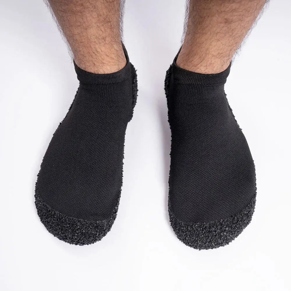 Top view of DIRTS barefoot socks on feet
