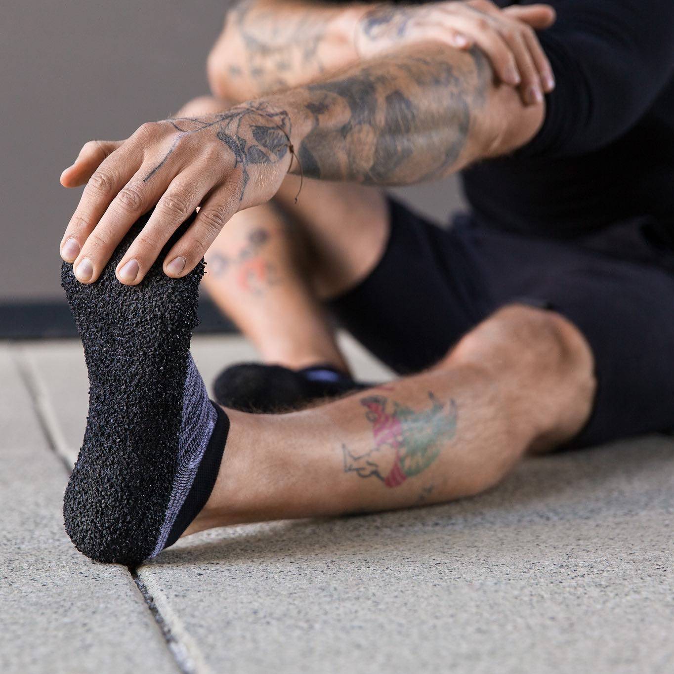 Stretching with DIRTS Black Barefoot Sock Shoes
