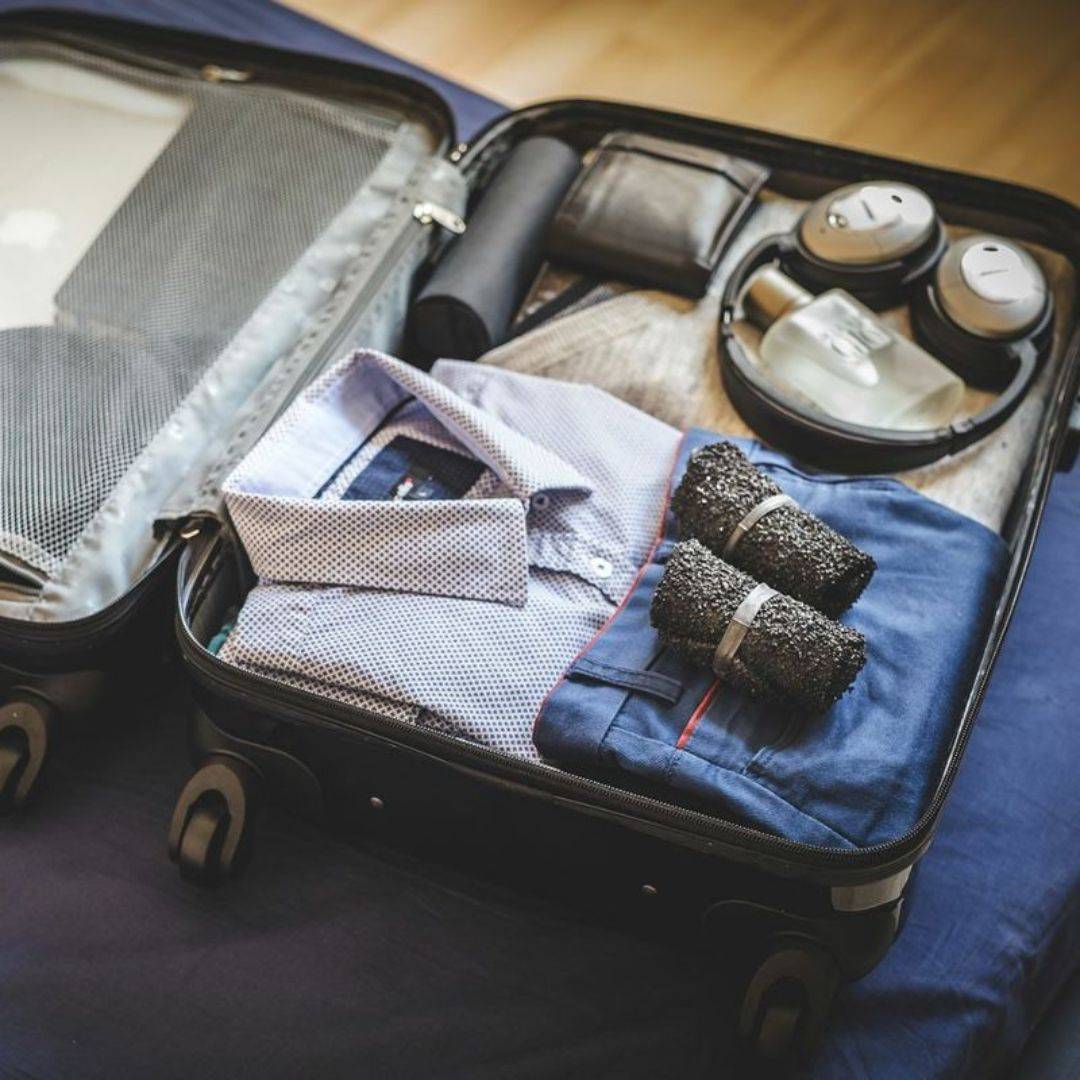 DIRTS Black Barefoot Sock Shoes packed in suitcase